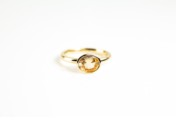 Yellow sapphire bezel set ring in yellow gold by Tamahra Prowse