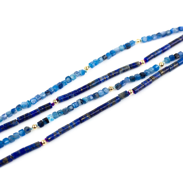 Fine lapis lazuli necklace with solid gold accents. Beaded on silk thread. Stacking necklace