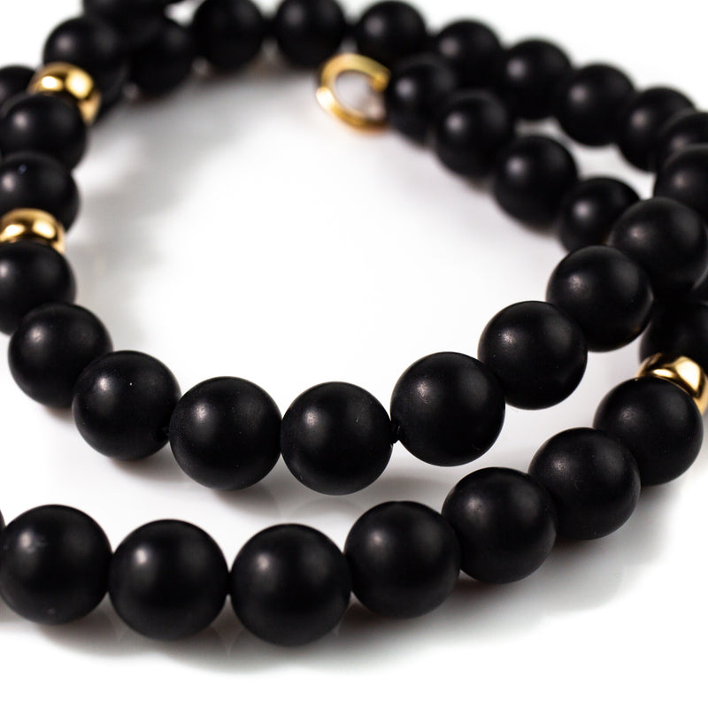 8mm matt black onyx beaded necklace with solid gold accents by jewellery designer Tamahra Prowse. 
