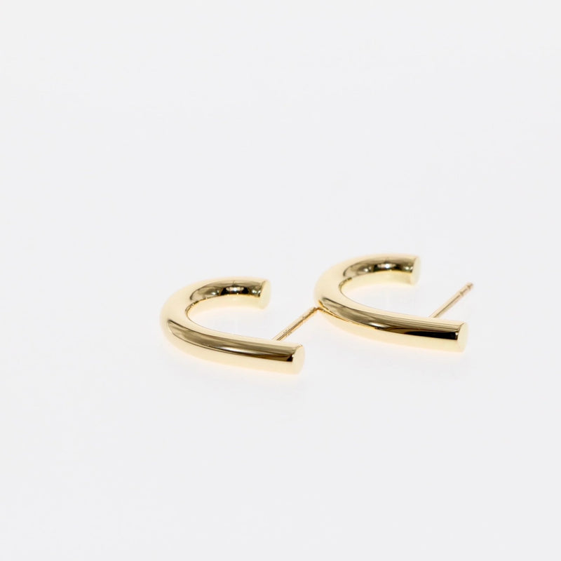 J earrings by Tamahra Prowse. Gold with a punk edge.