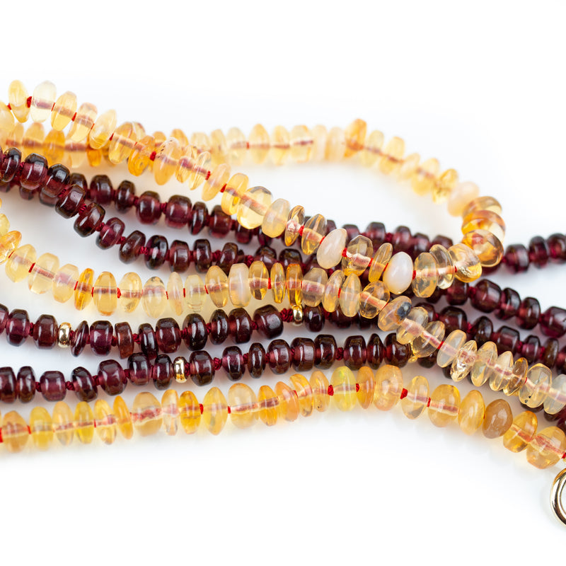 4mm garnet beads hand knotted on red silk and finished with solid gold beads and clasp ends. By designer Tamahra Prowse this necklace measures 50.5cm long.