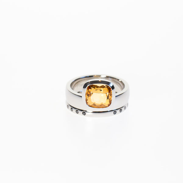 Engagement and wedding ring set set with yellow topaz and black diamonds.