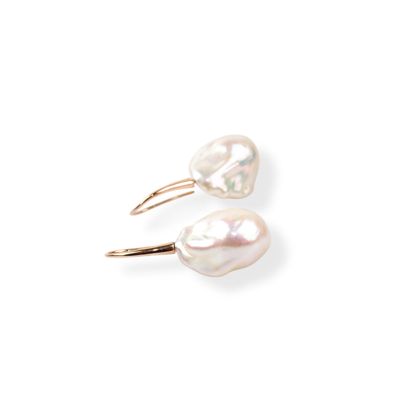 Large freshwater baroque pearl earrings set on rose gold hooks