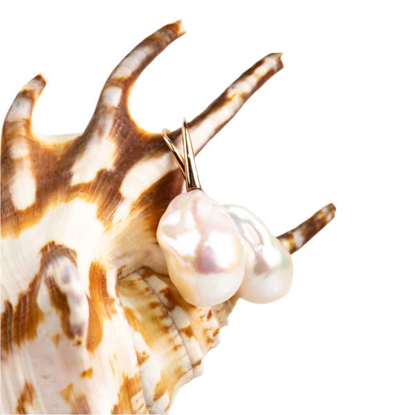 Large baroque pearl earrings set on 18kt rose gold hooks