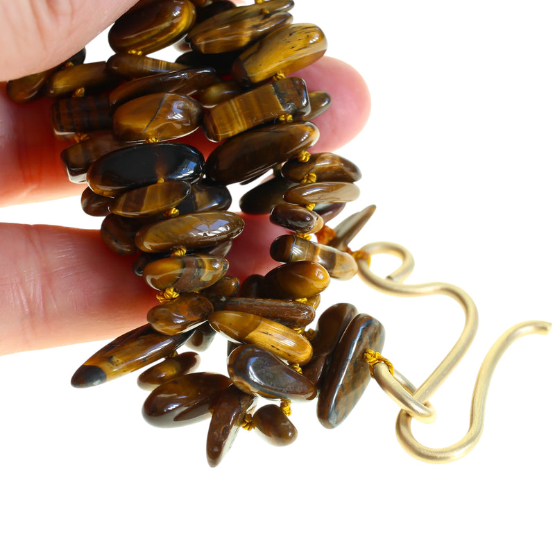 Large gold hook with a tiger eye beaded necklace