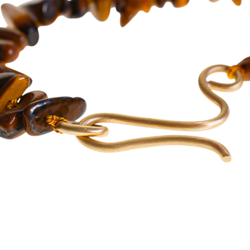 Large gold hook with a tiger eye beaded necklace