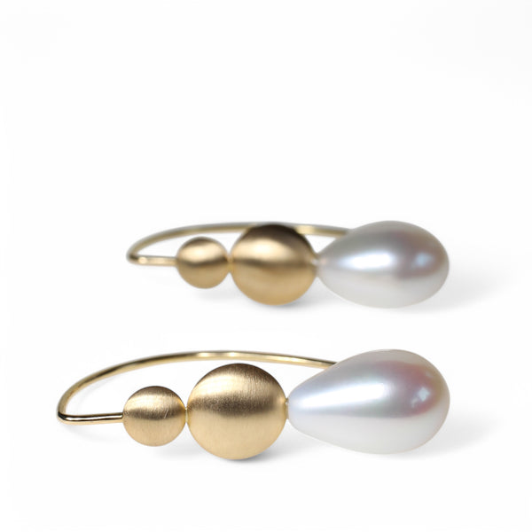 Pearl drop earrings with gold disc details by designer Tamahra Prowse