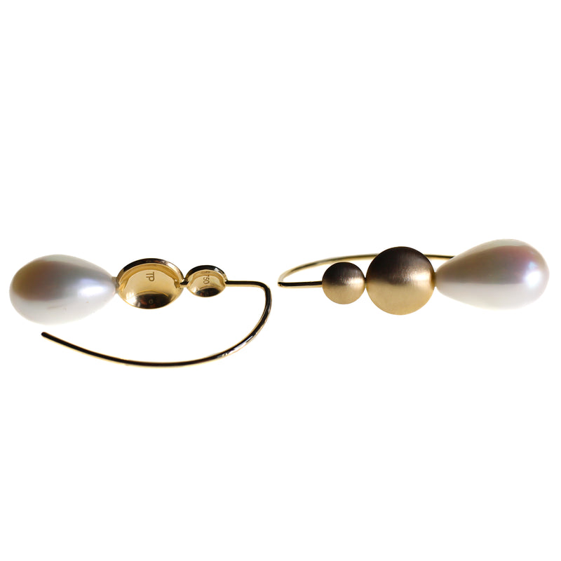 Pearl drop earrings with gold disc details by designer Tamahra Prowse