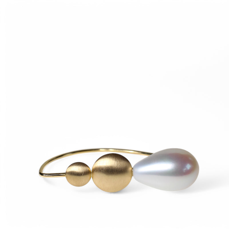 Pearl drop earrings with gold disc details by designer Tamahra Prowse