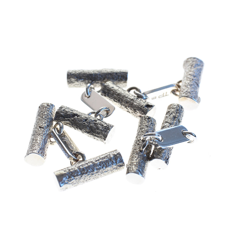 Sterling silver men's cufflinks cast from twigs, articulated bar in centre joins the two pieces.