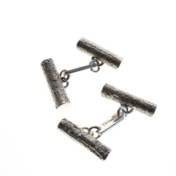 Sterling silver men's cufflinks cast from twigs, articulated bar in centre joins the two pieces.