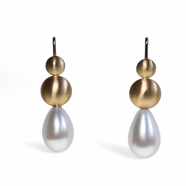 Pearl drop earrings with gold disc details by designer Tamahra Prowse