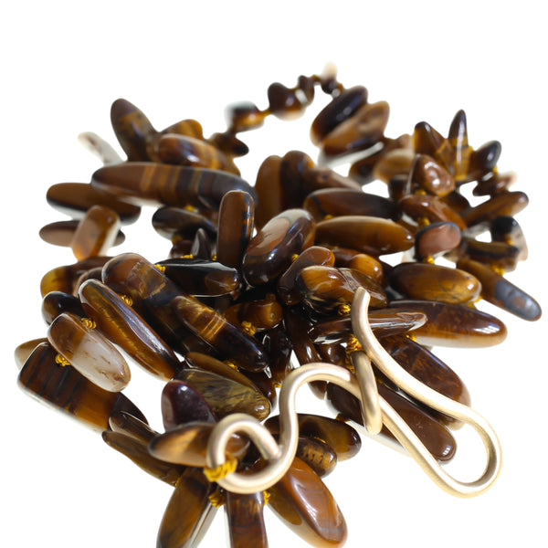 Large gold hook with a tiger eye beaded necklace