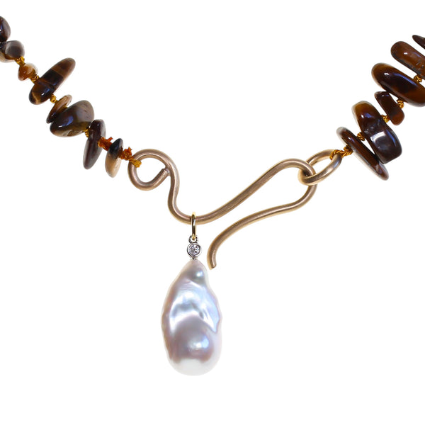 Large gold hook with a tiger eye beaded necklace with baroque pearl pendant