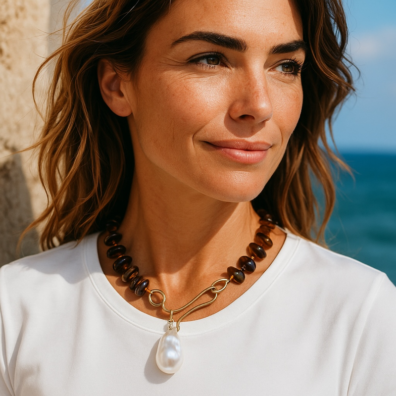 Large gold hook with a tiger eye beaded necklace with baroque pearl pendant
