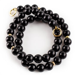 Polished onyx necklace with solid gold accents by Tamahra Prowse