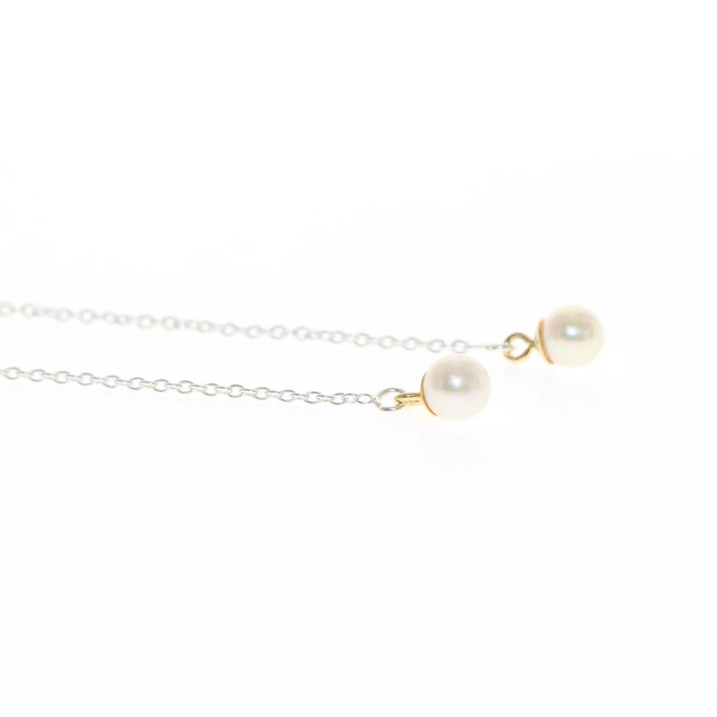 Tiny pearl threader earrings in silver and gold by Tamahra Prowse