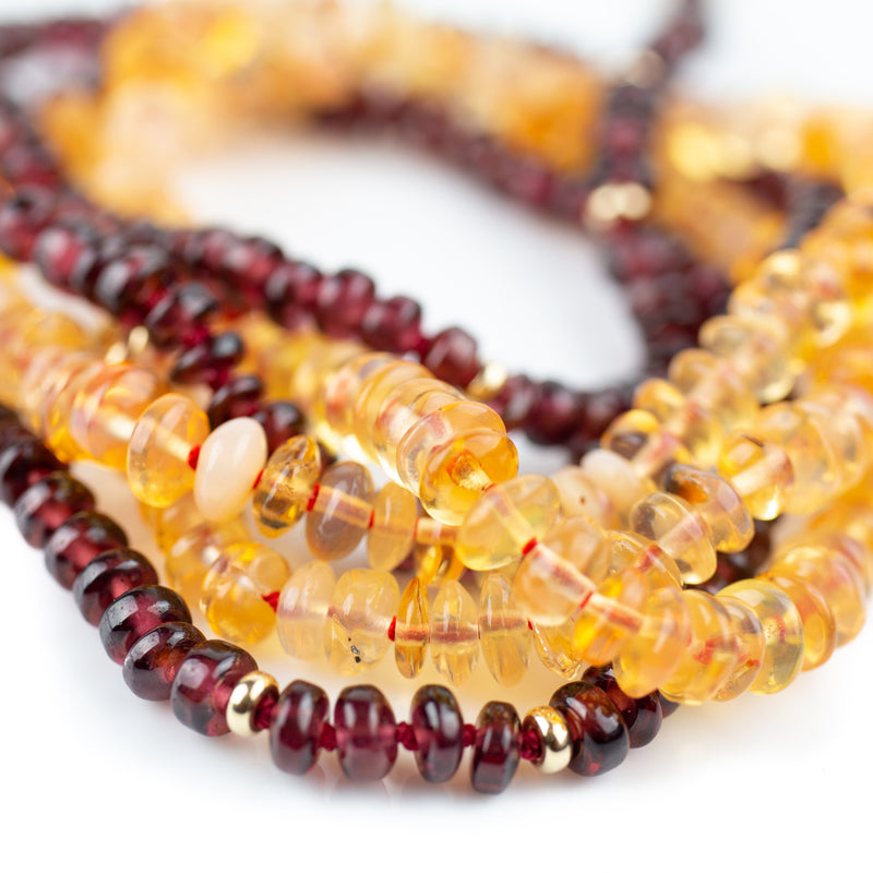 4mm garnet beads hand knotted on red silk and finished with solid gold beads and clasp ends. By designer Tamahra Prowse this necklace measures 50.5cm long.